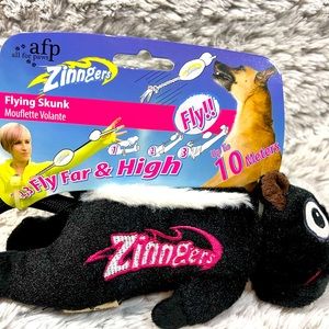 Zinger flying skunk toy